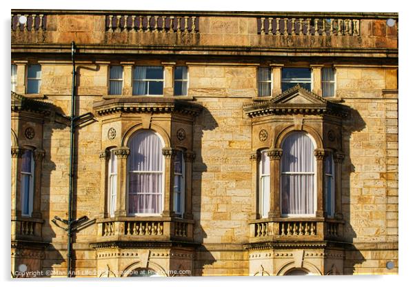 Close-up of a classic sandstone building facade with ornate windows and architectural details in warm sunlight in Harrogate, England. Acrylic by Man And Life