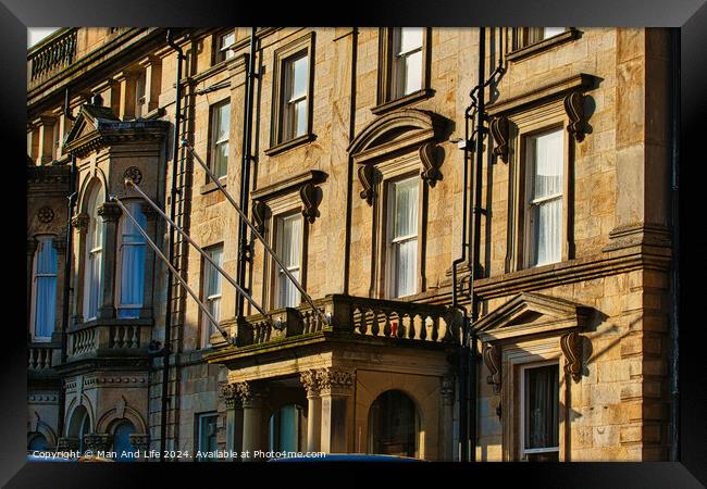Sunlit classic European architecture with ornate facades and windows in Harrogate, England. Framed Print by Man And Life