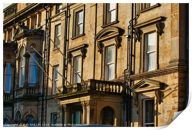Sunlit classic European architecture with ornate facades and windows in Harrogate, England. Print by Man And Life