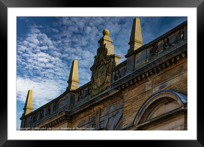 Historic building facade with ornate sculptures against a blue sky with clouds in Harrogate, England. Framed Mounted Print by Man And Life