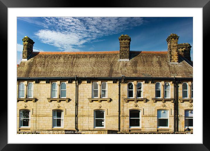 Traditional brick row houses under blue sky with wispy clouds in Harrogate, England. Framed Mounted Print by Man And Life