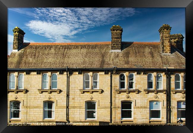 Traditional brick row houses under blue sky with wispy clouds in Harrogate, England. Framed Print by Man And Life