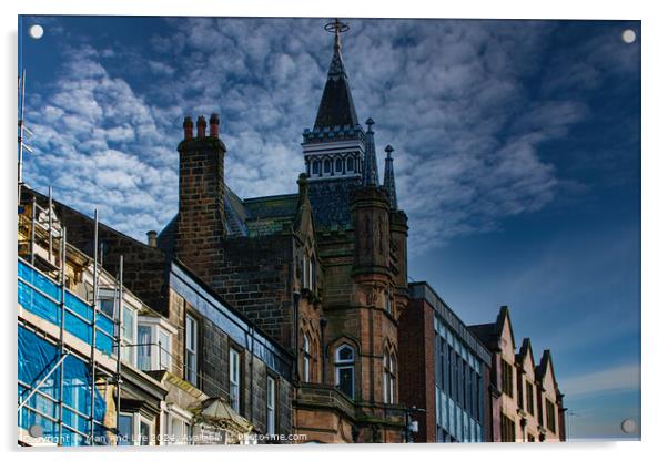 Historic architecture with a spire against a dramatic sky, flanked by modern buildings and scaffolding in Harrogate, England. Acrylic by Man And Life
