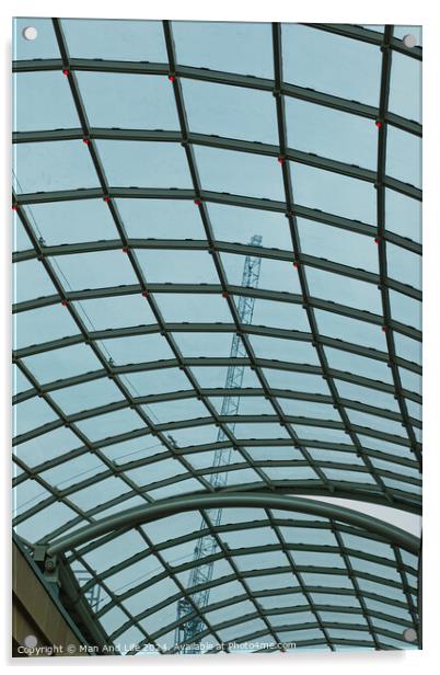 Abstract view of a glass ceiling with a metal frame, showcasing geometric patterns and a clear blue sky in the background. Acrylic by Man And Life