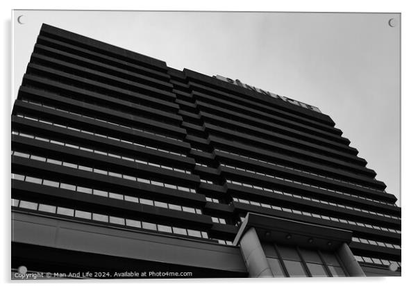 Modern black and white architectural photograph of a high-rise building with a patterned facade against a cloudy sky in Leeds, UK. Acrylic by Man And Life