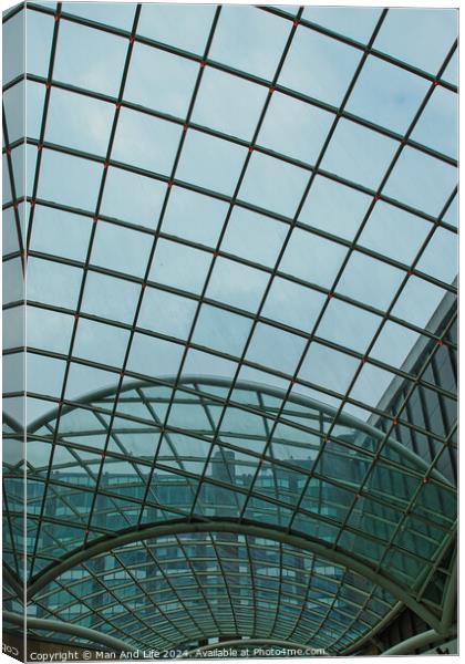 Modern glass ceiling architecture with geometric pattern against a blue sky in Leeds, UK. Canvas Print by Man And Life