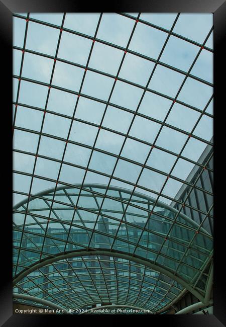 Modern glass ceiling architecture with geometric pattern against a blue sky in Leeds, UK. Framed Print by Man And Life