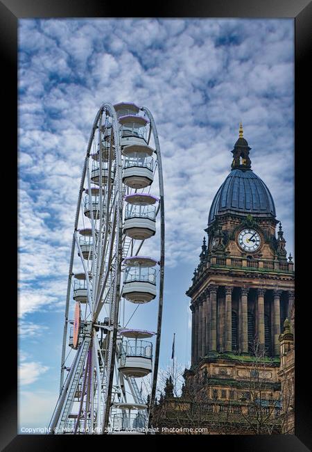 Ferris wheel beside a historic clock tower under a cloudy sky in Leeds, UK. Framed Print by Man And Life
