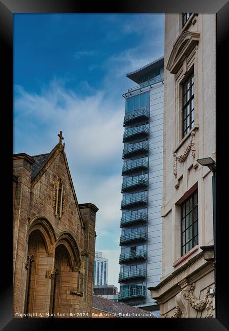 Contrast of old and new architecture with a historic church in the foreground and a modern skyscraper in the background against a blue sky in Leeds, UK. Framed Print by Man And Life