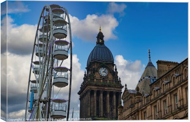 Ferris wheel beside a historic clock tower under a blue sky with clouds in Leeds, UK. Canvas Print by Man And Life