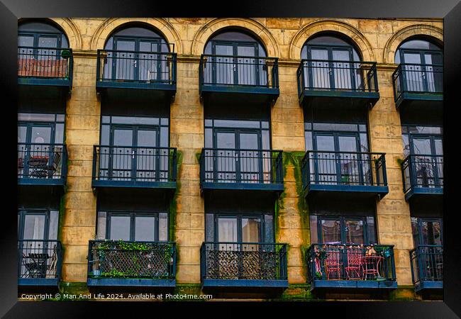 Facade of a vintage building with ornate windows and balconies in Leeds, UK. Framed Print by Man And Life