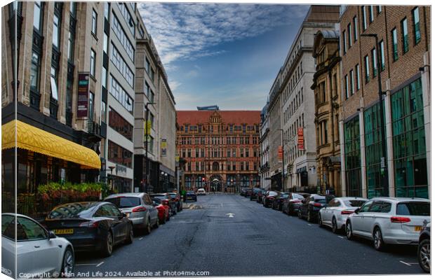 Urban street view with parked cars and historic buildings under a cloudy sky in Leeds, UK. Canvas Print by Man And Life