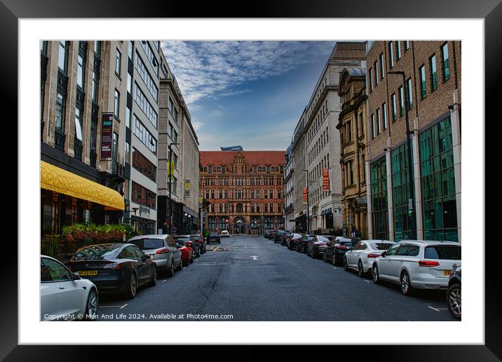 Urban street view with parked cars and historic buildings under a cloudy sky in Leeds, UK. Framed Mounted Print by Man And Life
