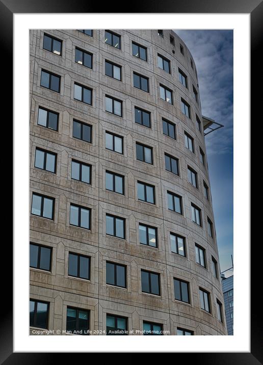 Modern curved office building facade against a clear blue sky in Leeds, UK. Framed Mounted Print by Man And Life