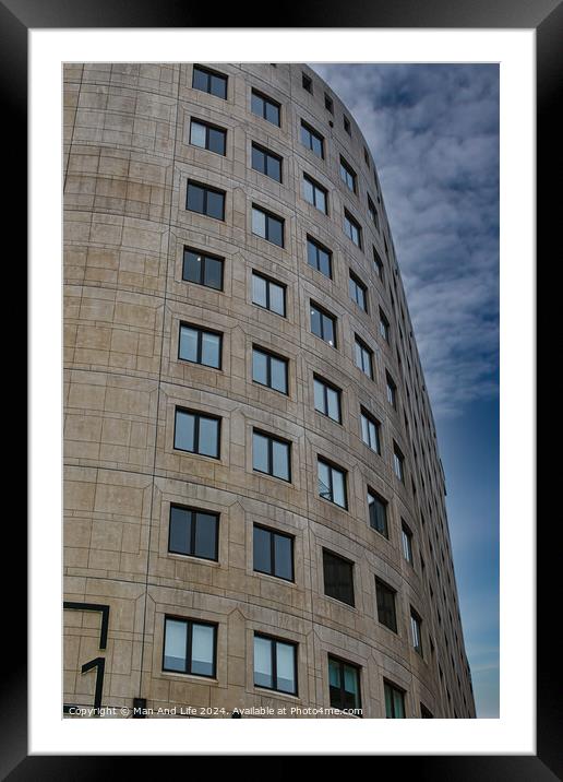 Curved modern office building facade with symmetric windows against a cloudy sky in Leeds, UK. Framed Mounted Print by Man And Life