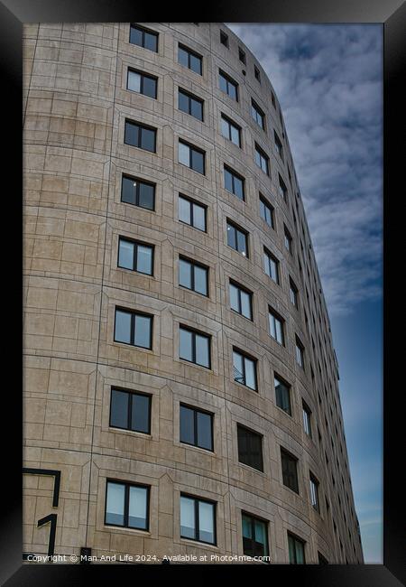 Curved modern office building facade with symmetric windows against a cloudy sky in Leeds, UK. Framed Print by Man And Life