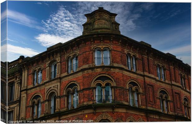 Victorian architecture with ornate windows against a cloudy sky in Leeds, UK. Canvas Print by Man And Life