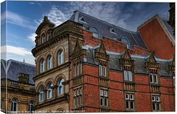 Victorian architecture with ornate details and blue sky in Leeds, UK. Canvas Print by Man And Life
