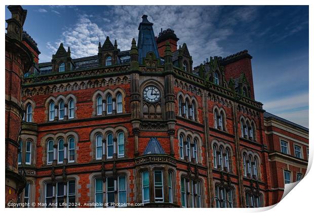 Gothic-style red brick building with clock tower under a moody sky in Leeds, UK. Print by Man And Life