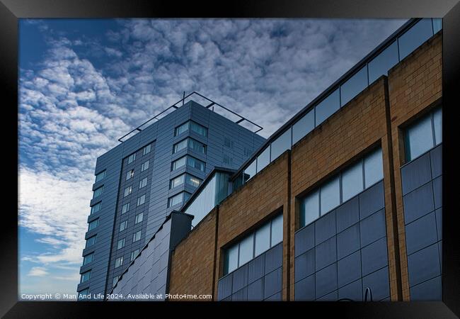 Modern urban architecture with blue sky and clouds in Leeds, UK. Framed Print by Man And Life