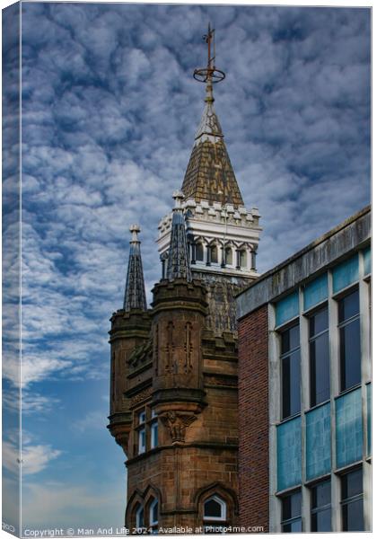 Historic tower with spire against a dramatic cloudy sky, juxtaposed with modern building facade in Leeds, UK. Canvas Print by Man And Life