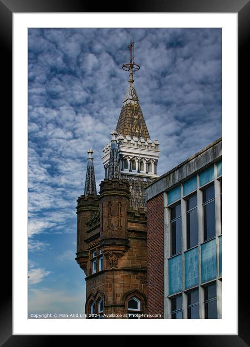 Historic tower with spire against a dramatic cloudy sky, juxtaposed with modern building facade in Leeds, UK. Framed Mounted Print by Man And Life