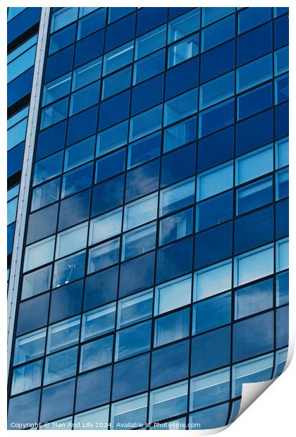Modern glass building facade reflecting blue sky with clouds, architectural details and textures, urban background in Leeds, UK. Print by Man And Life