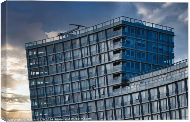 Modern office building facade against a dramatic sunset sky in Liverpool, UK. Canvas Print by Man And Life