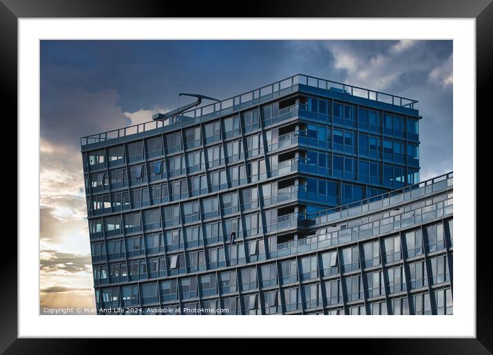 Modern office building facade against a dramatic sunset sky in Liverpool, UK. Framed Mounted Print by Man And Life