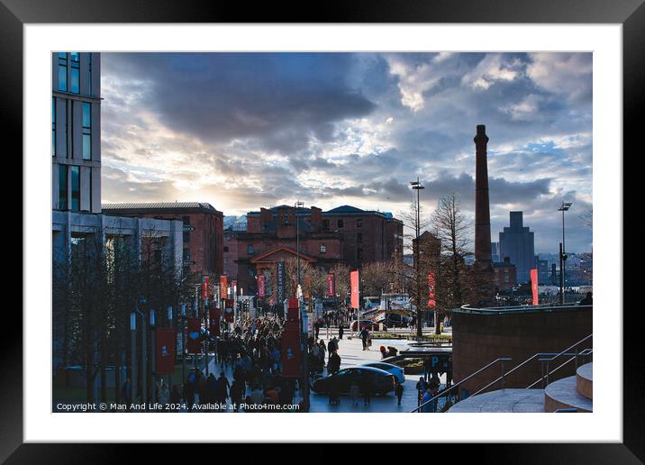 Dramatic urban sunset with silhouetted buildings and vibrant sky, people walking in a cityscape in Liverpool, UK. Framed Mounted Print by Man And Life