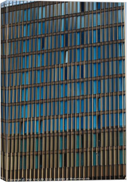 Modern office building facade with blue glass windows and steel structure, architectural background in Liverpool, UK. Canvas Print by Man And Life