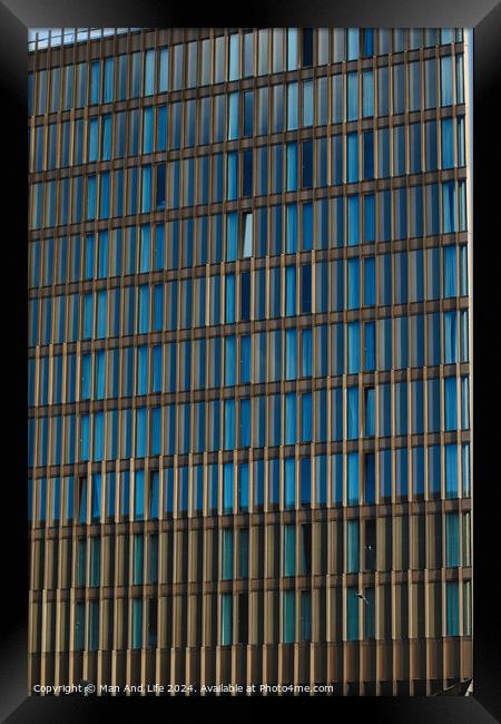 Modern office building facade with blue glass windows and steel structure, architectural background in Liverpool, UK. Framed Print by Man And Life