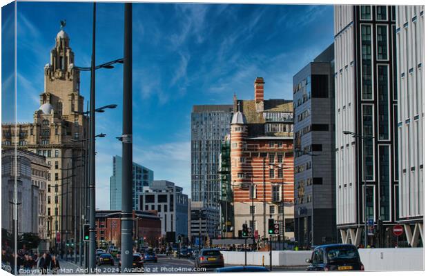 Urban cityscape with modern and historic architecture under a clear blue sky in Liverpool, UK. Canvas Print by Man And Life