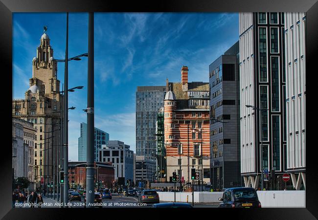 Urban cityscape with modern and historic architecture under a clear blue sky in Liverpool, UK. Framed Print by Man And Life