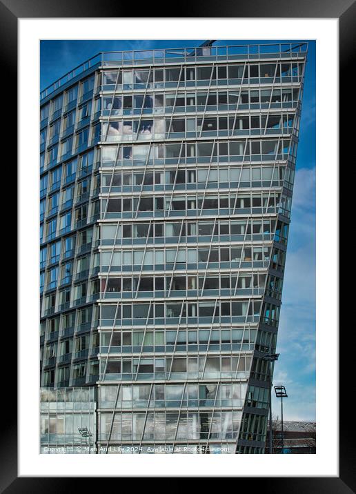 Modern office building under construction with scaffolding against a blue sky in Liverpool, UK. Framed Mounted Print by Man And Life