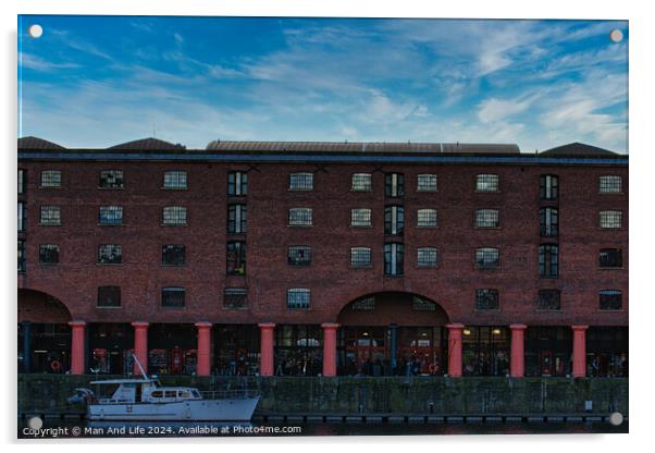 Brick warehouse with arched supports by a canal with a moored boat under a clear blue sky in Liverpool, UK. Acrylic by Man And Life