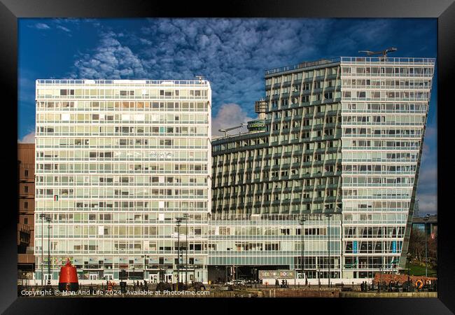 Modern office buildings with reflective glass facades against a blue sky with clouds in Liverpool, UK. Framed Print by Man And Life