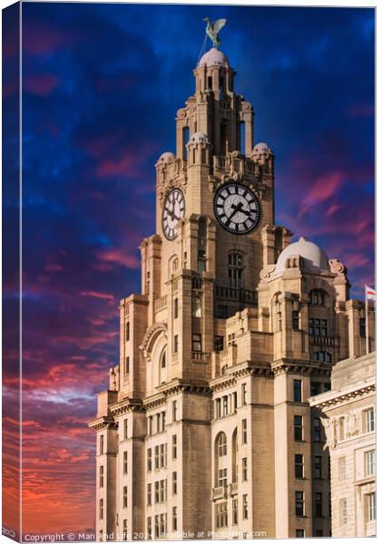 Historic clock tower building against a vibrant sunset sky in Liverpool, UK. Canvas Print by Man And Life