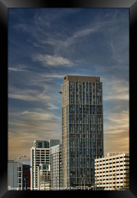 Modern skyscraper against a blue sky with clouds, showcasing contemporary urban architecture in Liverpool, UK. Framed Print by Man And Life
