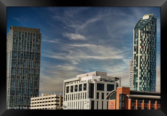 Modern cityscape with skyscrapers against a blue sky with wispy clouds in Liverpool, UK. Framed Print by Man And Life