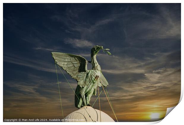 Bronze statue of an angel with outstretched wings against a vibrant sunset sky in Liverpool, UK. Print by Man And Life