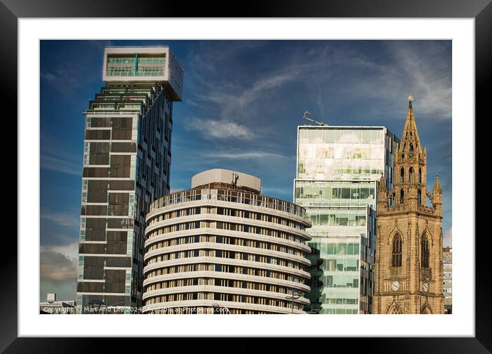 Modern city skyline with a mix of contemporary buildings and a historic church under a blue sky with clouds in Liverpool, UK. Framed Mounted Print by Man And Life