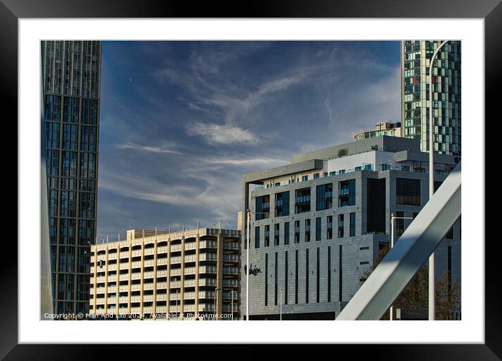 Modern cityscape with skyscrapers and a construction site against a blue sky with clouds in Liverpool, UK. Framed Mounted Print by Man And Life