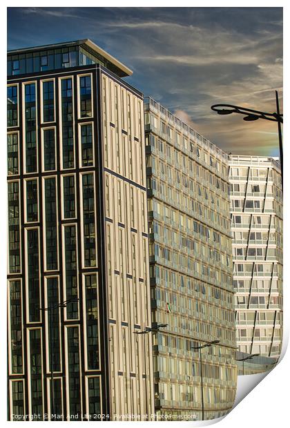 Modern urban architecture with reflective glass facade and contrasting building designs under a blue sky with clouds in Liverpool, UK. Print by Man And Life
