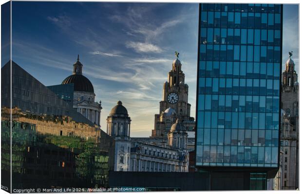 Contrast of old and new architecture with historic domes beside a modern glass skyscraper against a dusk sky in Liverpool, UK. Canvas Print by Man And Life