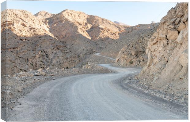 Winding Dirt Road in the Harim Desert Mountains, Musandam, Oman Canvas Print by Dave Collins