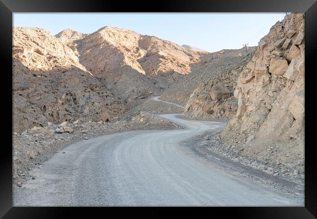 Winding Dirt Road in the Harim Desert Mountains, Musandam, Oman Framed Print by Dave Collins