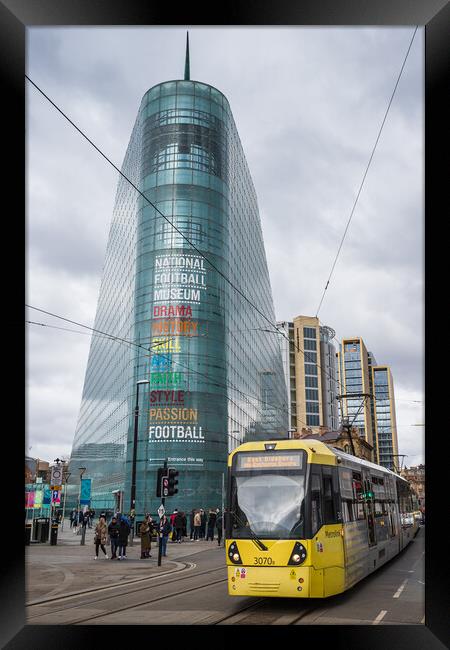 Tram passes the National Football Museum Framed Print by Jason Wells
