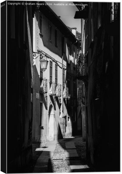 Old street in Orta Italy monochrome Canvas Print by Graham Moore