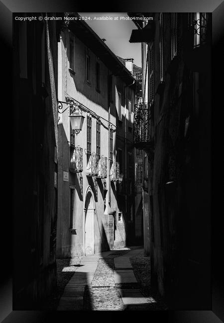 Old street in Orta Italy monochrome Framed Print by Graham Moore